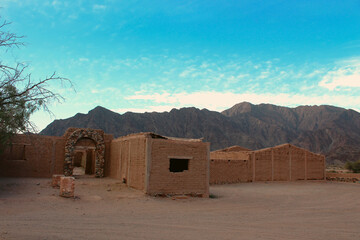 Adobe homes standing resilient against nature’s elements.