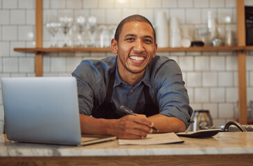 Cafe, happy man and portrait of barista writing order on menu for stock check or calculate sales at startup. Face, coffee shop and entrepreneur with laptop, waiter or owner at small business in Chile