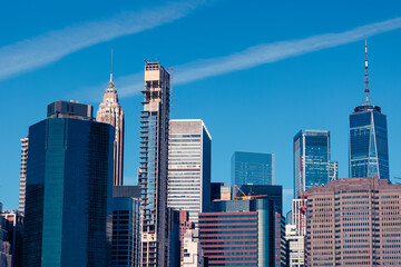 Downtown Manhattan Skyline : A stunning view showcasing iconic skyscrapers and the historic bridge,...