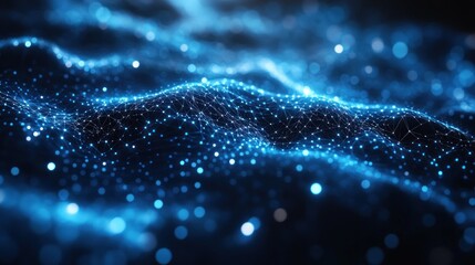 Abstract representation of glowing blue particles in a wave-like form.