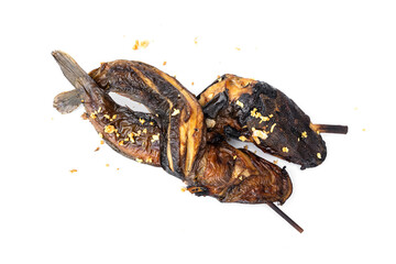 Simple fish menu. Delicious Thai street food that is available everywhere. Two grilled catfish skewers crossed on bamboo skewers and sprinkle with fried garlic isolated on white background.
