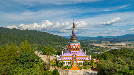 Aerial iew of the colorful pagoda Overlooking Verdant Valley Pagodas are an important architectural feature in wat Thaton Chiang Mai serving as religious or spiritual landmarks.Kok river