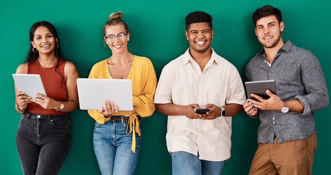 Creative people, portrait or waiting room with technology for career or job opportunity on a green wall background. Young, group or happy interns with smile in row or line for design or team startup