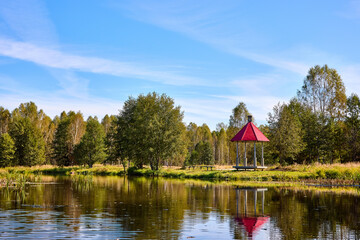 Tranquil Waterfront Gazebo on Sunny Day