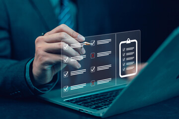 Businessman using laptop Concept of business performance tracking and evaluation Survey Check...