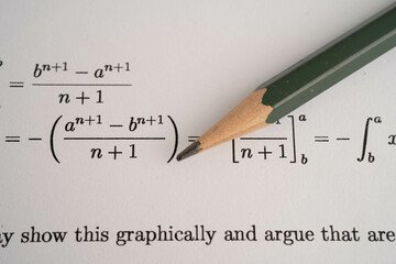 Pencil on mathematic formula exercise test paper in education school.