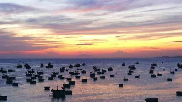 Mui Ne fishing village in sunset sky with hundreds of boats anchored to avoid storms, this is a beautiful bay in central Vietnam
