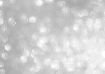 Background grey bokeh abstarct white beige circle light texture bubble blur pattern defocused glowing sparkle snow glitter snowflake magig backdrop ecosystem foreground card silver space decoration.
