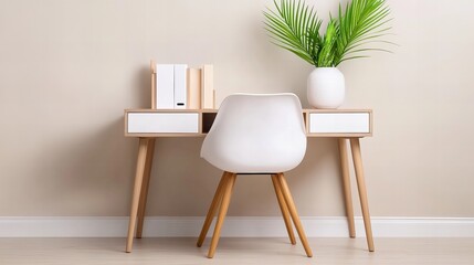 Fototapeta premium A minimalist home office desk with a white chair and a plant in a white vase.