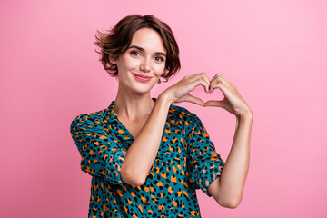 Portrait of lovely thankful cheerful woman with bob hairdo wear print blouse fingers show heart...