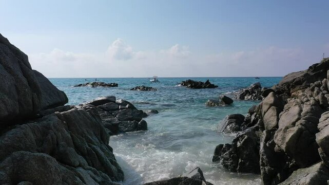 Aerial view of sea and rocky beach in Marinella Di Zambrone on a sunny summer day in Calabria, Italy