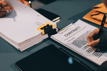 Judge gavel with Justice lawyers having team meeting at law firm background. Concepts of Law and Legal services.