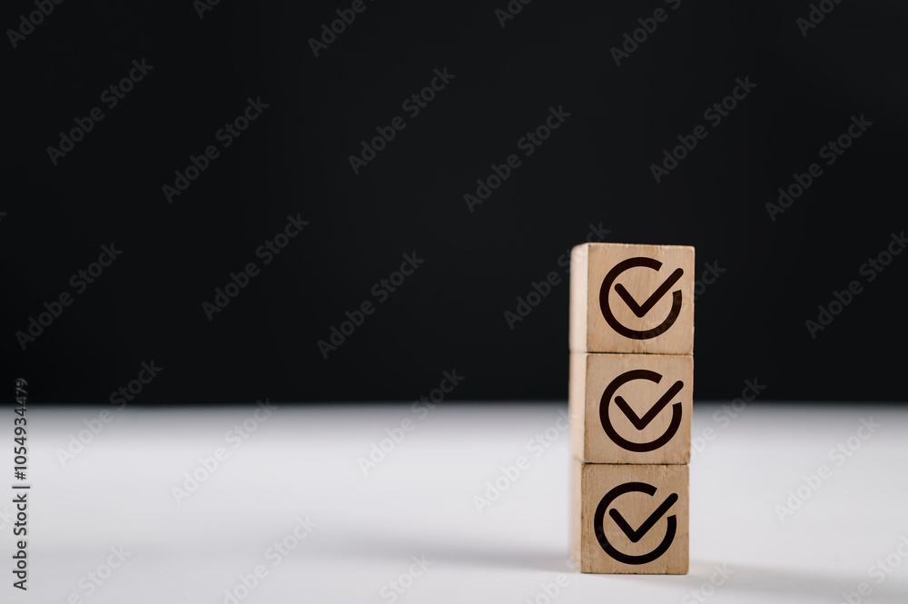 Poster check mark icons for jobs list on the face of wooden stacked blocks. task lists, checklist, survey, 