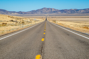 Long, straight highway in the desert Southwest 