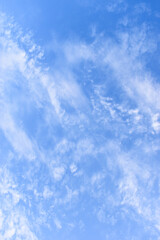 beautiful blue sky and white fluffy group of clouds with sunrise in the morning, natural background