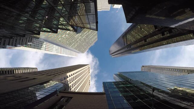Stunning skyscrapers emerge against a backdrop of a bright, clear sky in a modern cityscape