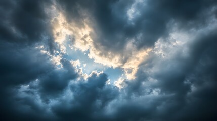 Obraz premium Sunlight Breaking Through Dark Storm Clouds