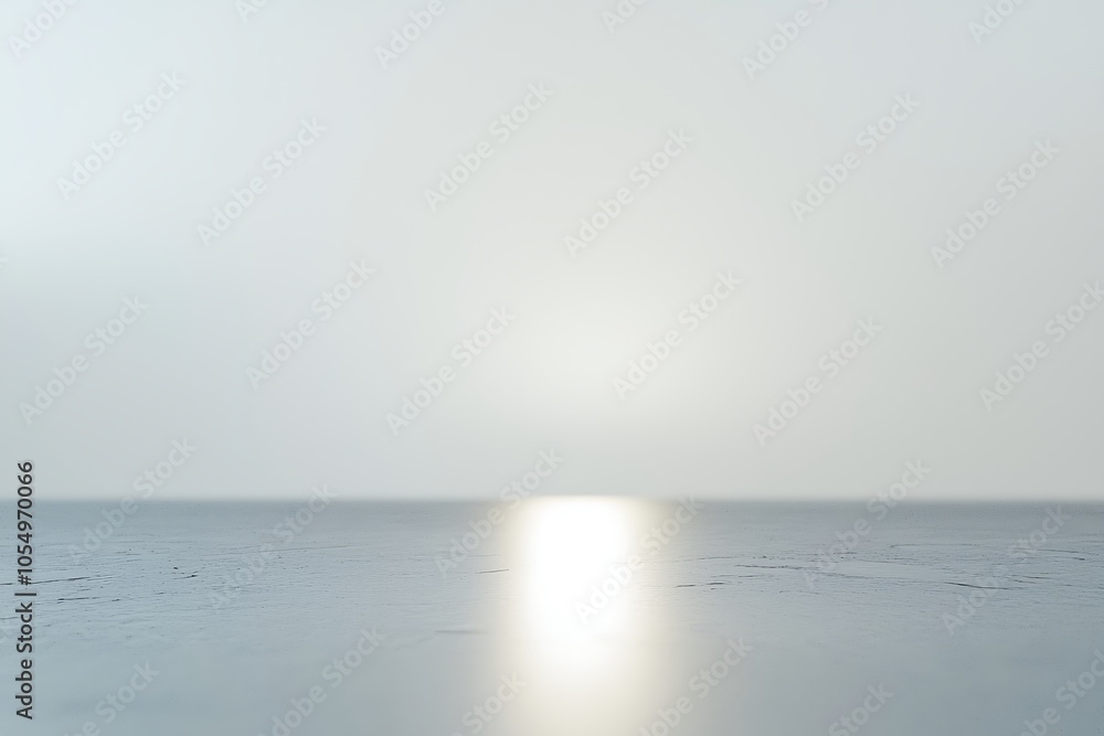 Poster a minimalist scene featuring soft light reflecting on a smooth surface, creating a tranquil and sere