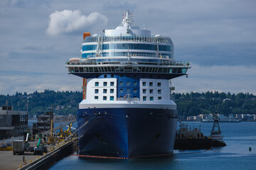 Modern Celebrity family cruiseships cruise ship ocean liners in port of Seattle, Washington State docked at terminal before Alaska summer cruising on sunny day