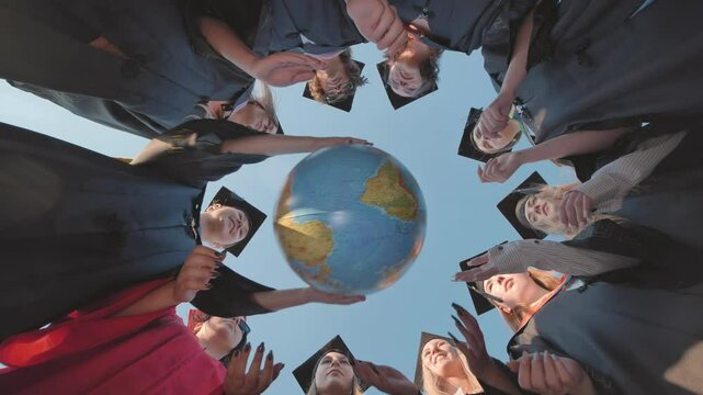 Graduates in academic robes encircling a globe, representing their preparedness to seize international opportunities