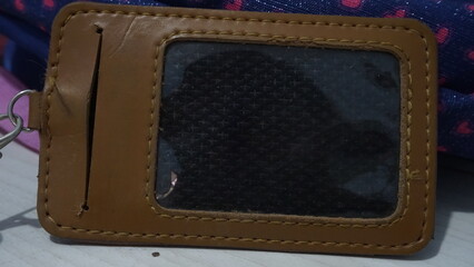 A brown nametag holder located on the table

