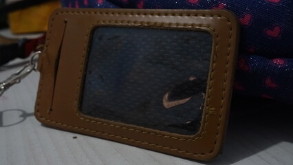 A brown nametag holder located on the table
