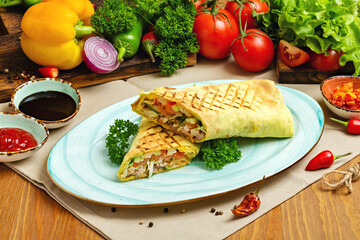 Shawarma, doner with chicken and vegetables on a plate. Restaurant, Cafe, lunch, dinner.