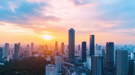 A stunning city skyline at sunset, showcasing modern skyscrapers with vibrant hues of orange and purple lighting up the sky.