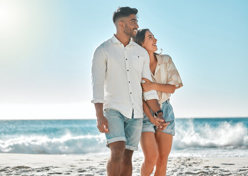 View, romance or couple hug at sea holding hands for love on vacation, anniversary or holiday. Adventure, happy and people at beach for bonding together for romantic trip on tropical island in Spain