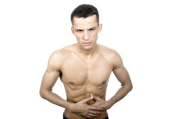 Fototapeta premium Young attractive man posing in studio. Pain and health problems.