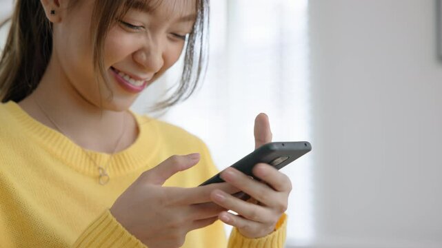 Closeup Young adult asia people Gen z girl relax take selfie photo snap shot chat show share using snapchat app post viral send text video vlog IG reels story instagram. Fun joy woman happy at home.