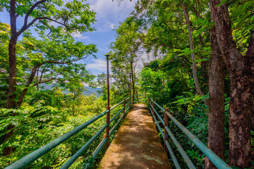 Background of the tourist attraction on the top of Suthep 2 mountain in Phitsanulok, Thailand, Khao Samo Khlang Pagoda, can see the beautiful scenery of mountains and rice fields.
