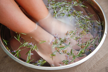 Foot baths with rosemary leaves