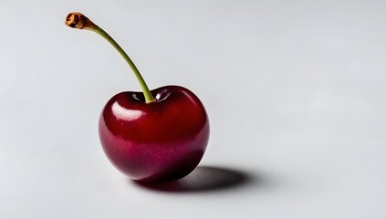 Close-up of one red cherry on a white background, fresh and ripe cherry