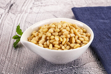 Peeled cedar nut in the bowl
