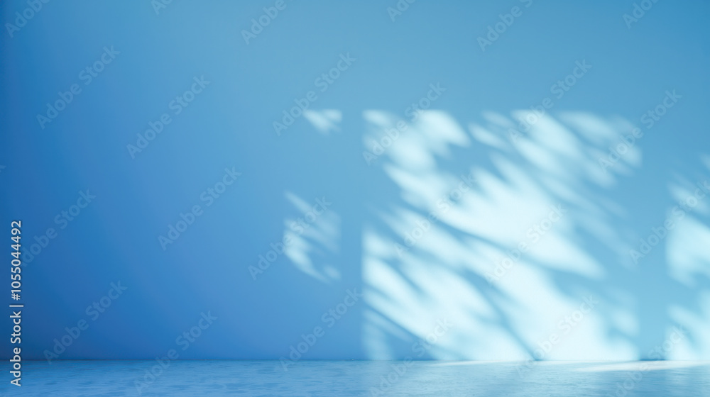 Aufkleber bright, empty blue space with soft sunlight creating playful abstract shadows on smooth walls. minim