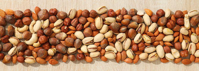 Assortment of different nuts on a wooden table