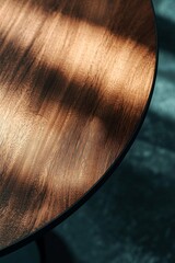 Fototapeta premium Modern minimalist-style dining table, close-up of the tabletop on a dark background, with a solid wood texture and a textured surface.