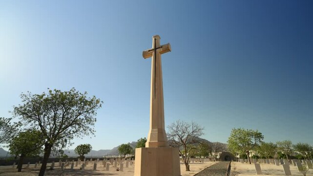Keren or Cheren War Cemetery, Monument with cross to fallen soldiers, Eritrea in Africa. Low angle with sky in background