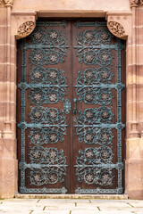 Gate of a gothic church near a Spanish palace