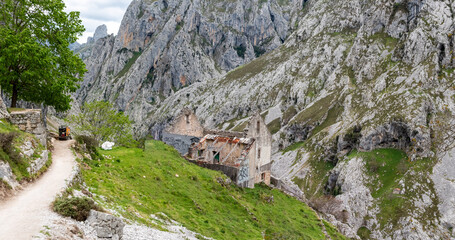 An abandoned ruined farmer house in the picturesque Cares gorge, Picos de Europa mountains in Asturias, Spain