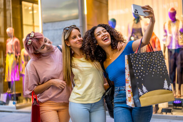 Friends taking selfie shopping in a mall