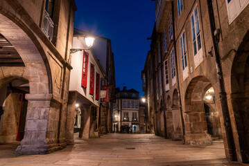 Empty little Rua do Vilar street with historic residential houses and picturesque passages in the...