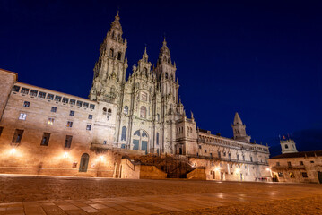 Fototapeta premium Famous Obradoiro square and baroque portal of the famous Santiago de Compostela cathedral at night, Galicia