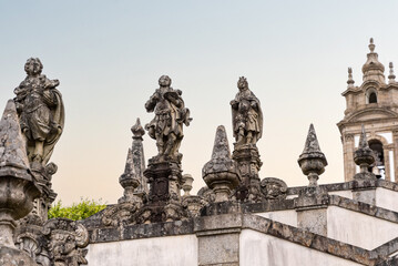 Scenic stone sculptures on the famous baroque stairway to basilica Bom Jesus do Monte in Braga