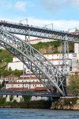 Architectural detail of iconic arched iron bridge Ponte Luis I in the Porto city center