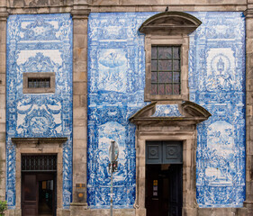 Picturesque historic Azulejo tiles at the exterior of chapel Almas de Santa Catarina in Porto