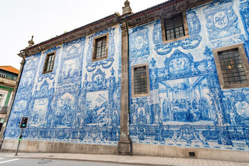 Picturesque historic Azulejo tiles at the exterior of chapel Almas de Santa Catarina in Porto