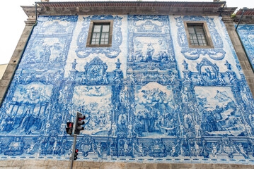 Picturesque historic Azulejo tiles at the exterior of chapel Almas de Santa Catarina in Porto
