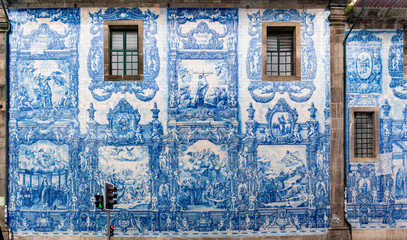 Picturesque historic Azulejo tiles at the exterior of chapel Almas de Santa Catarina in Porto